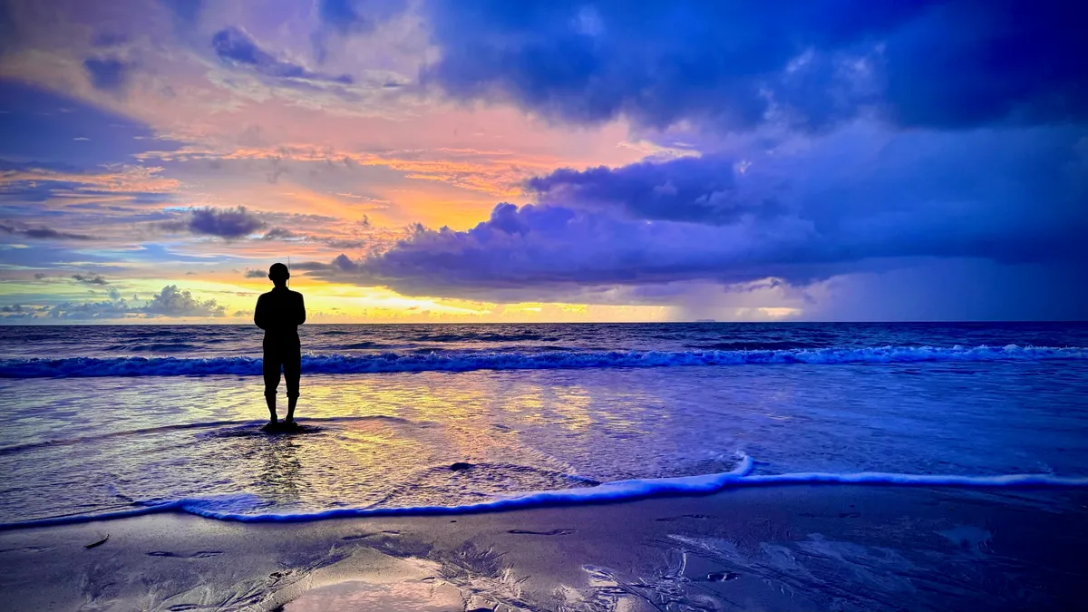 Man Fishing In The Sunset